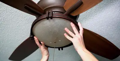 Ceiling fan repair and reinstallation on ceiling mount in Birmingham, AL