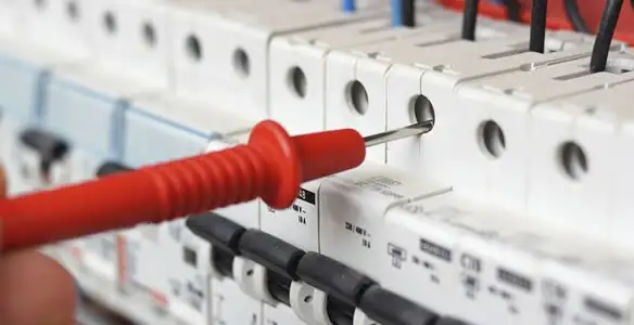 Electrical contractor testing circuit breakers during electrical repair in Gardendale, AL