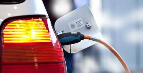 Electric car plugged into EV charger after professional installation in Birmingham, AL