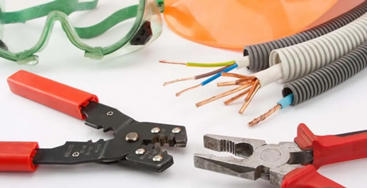 Electrical wiring repair with professional tools and safety equipment in Adamsville, AL