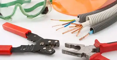 Electrical wiring repair with professional tools and safety equipment in Fairfield, AL