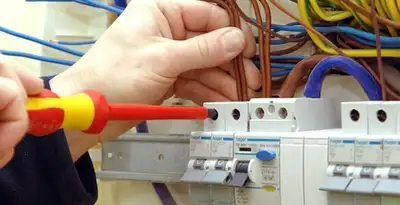 electrician services performing professional electrical panel wiring and connections in Birmingham, AL