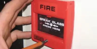 fire alarm installation service showing manual fire alarm pull station installed by licensed electricians in Birmingham, AL