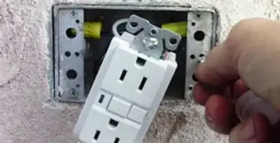 gfci circuits service showing installation of a ground fault circuit interrupter outlet by licensed electricians in Birmingham, AL