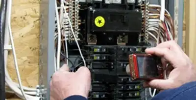 Home electrical inspection of circuit breaker panel by licensed electrician in Birmingham, AL
