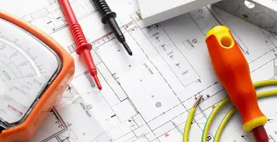 licensed electrician planning and testing electrical systems using professional tools in Birmingham, AL
