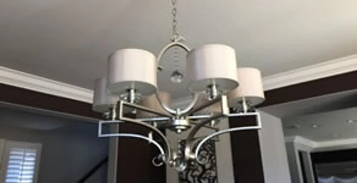 Modern chandelier installation with multiple light fixtures in Birmingham, AL