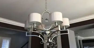 Modern chandelier installation with multiple light fixtures in Birmingham, AL