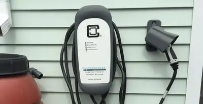 Outdoor electric vehicle charger installation on residential wall in Birmingham, AL