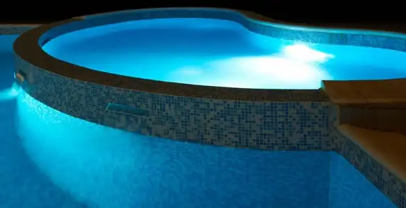 pool light installation and repair services highlighting illuminated pool interior lighting in Birmingham, AL
