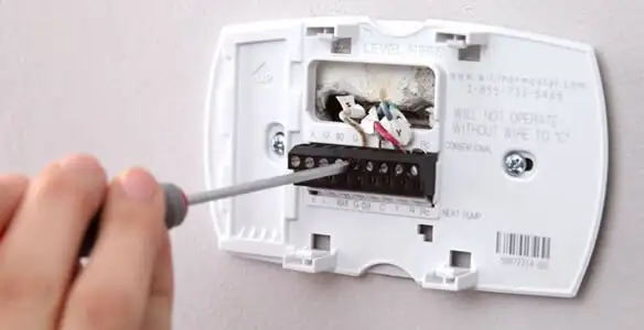 Thermostat installation service with proper wiring and secure wall mounting in Birmingham, AL